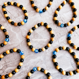 Evil eye black tourmaline palo santo stretch bracelet