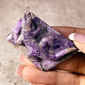 Charoite lizard carving