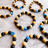 Evil eye black tourmaline palo santo stretch bracelet