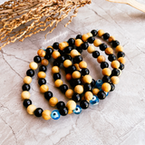 Evil eye black tourmaline palo santo stretch bracelet